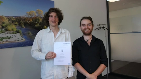 Steffen and Martin proudly showing the official founding document.